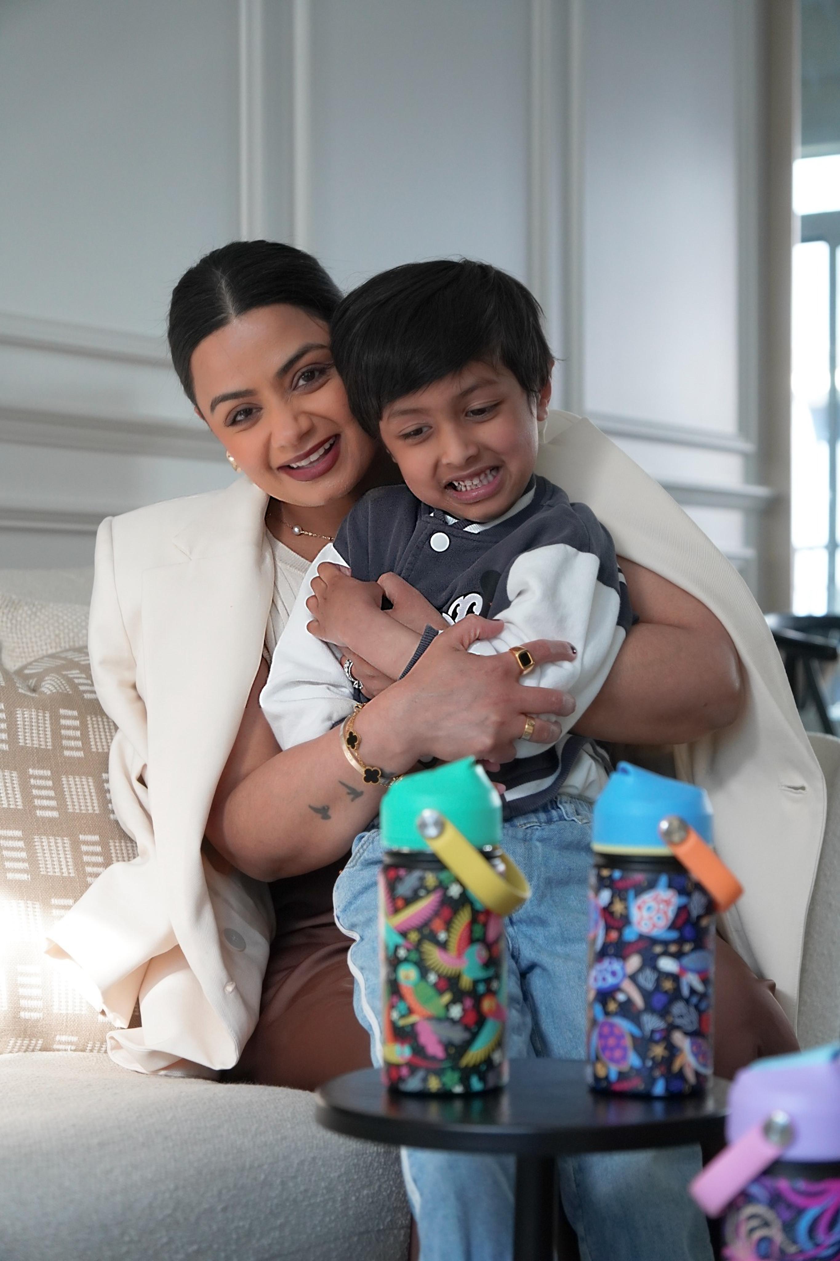 Mother and son excited with Inkaara children's bottles in front of them